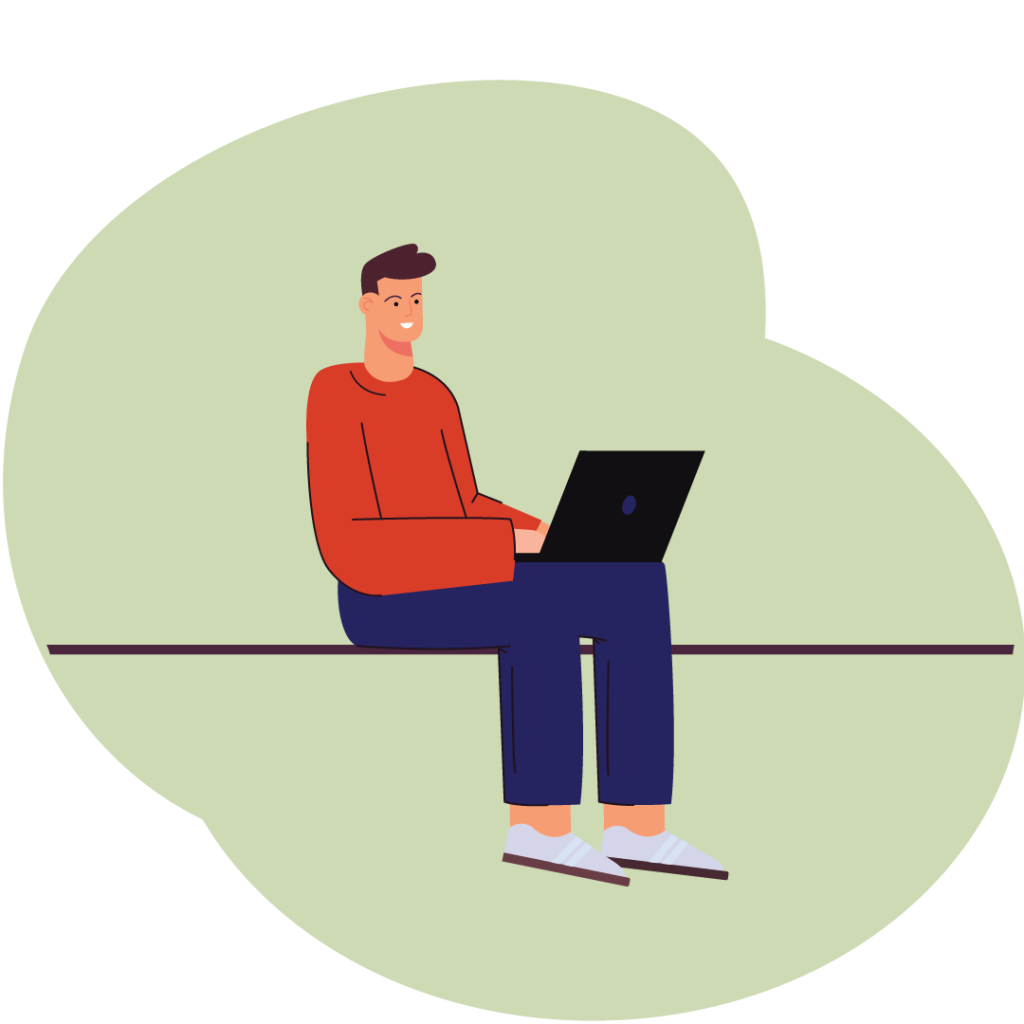 Guy sitting and working on a laptop